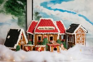 Festively decorated gingerbread houses and train.