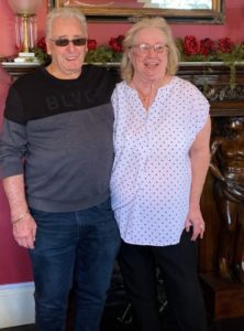 Man and woman standing in front of mantle