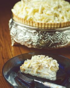 White chocolate banana cream pie on silver dish