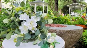 Silk wedding bouquet in blooming garden.