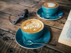 Two lattes on wooden table