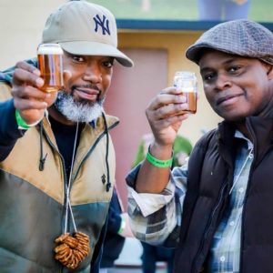 Two men toasting beer at festival