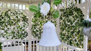 white wedding bell in gazebo