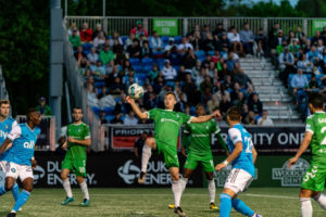 Greenville mens soccer team playing.