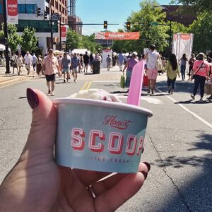 Scoop of ice cream on sunny day at street festival