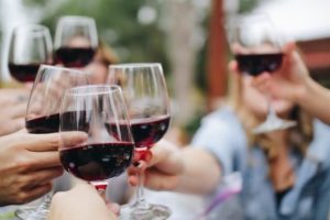 Wine glasses toasting with friends. 