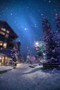 Starry night winter street in snow with light. 