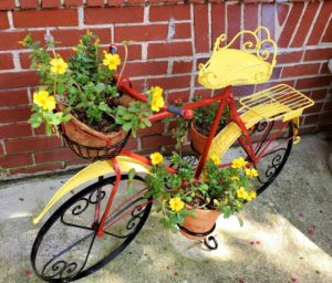 Yellow and red bike with flower cascade.