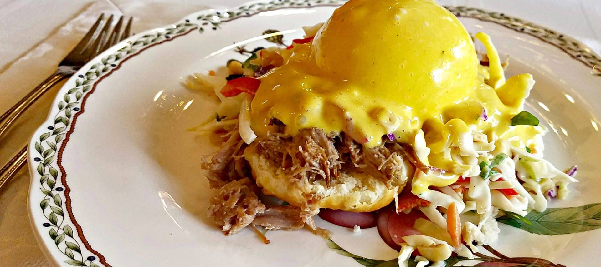 Poached egg with mustard Hollindaise on toasted buscit