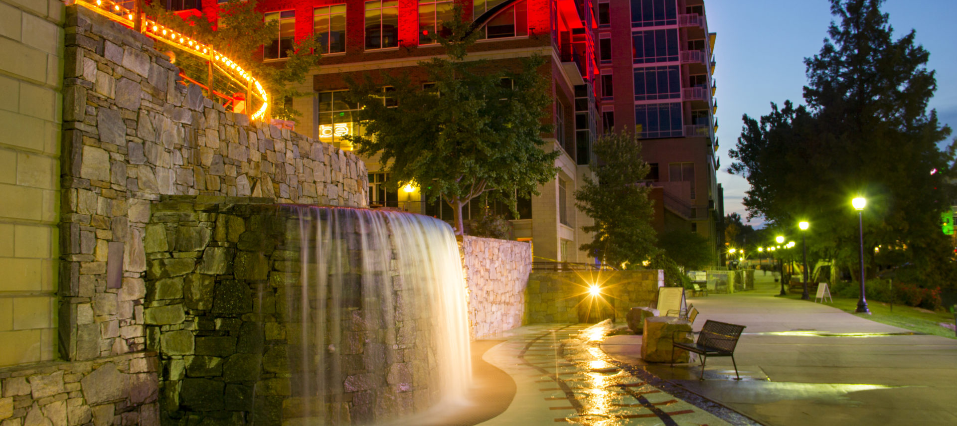 Water fall fountain on city street.