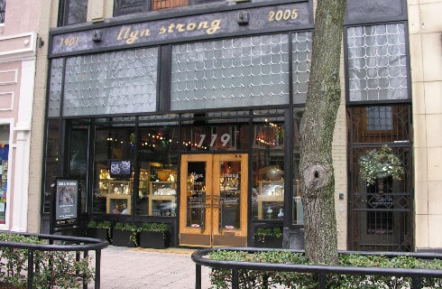 Modern looking storefront with glass and metal in a downtown shopping area.