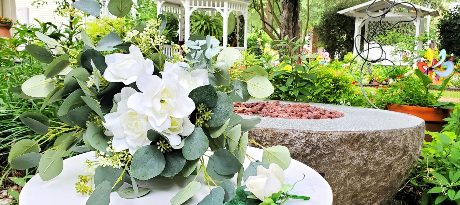 White and green wedding bouquet in garden setting