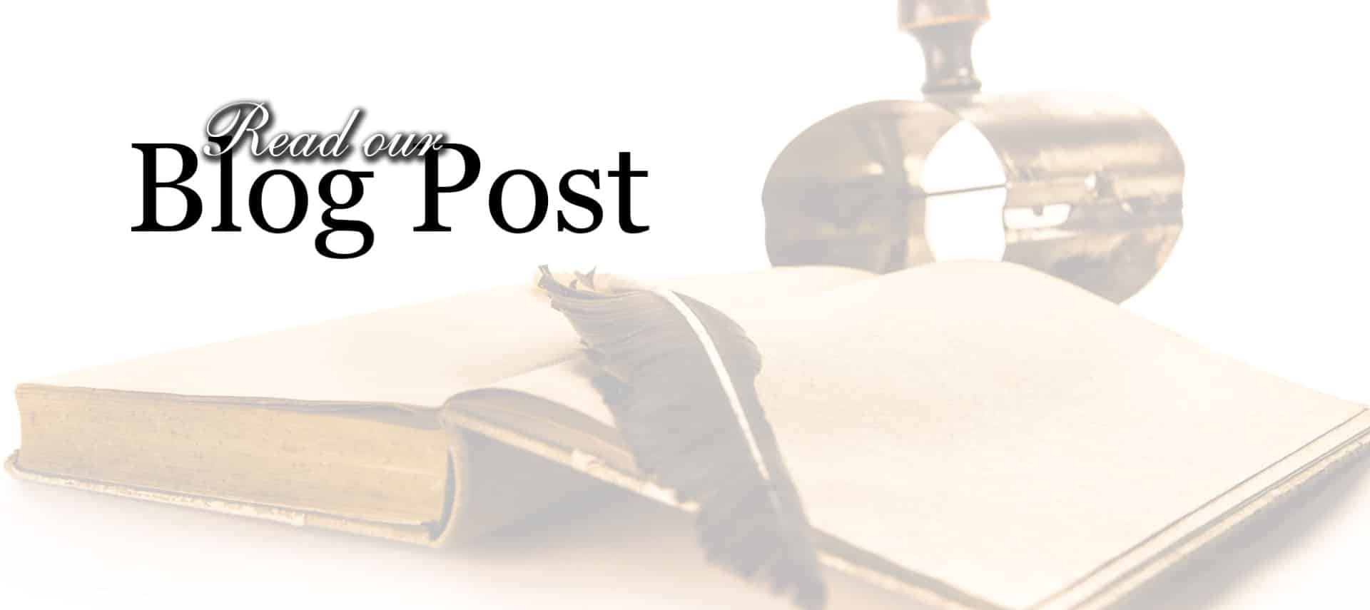 Antique book, quill, and ink container in the background with Read our Blog Post text in black