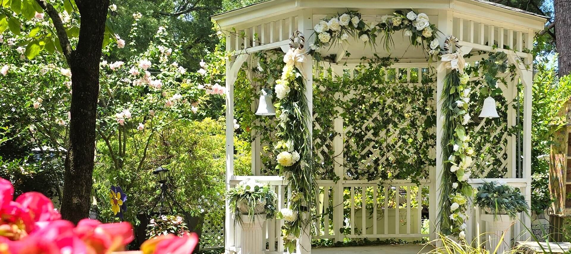 Garden gazebo decorated for wedding.
