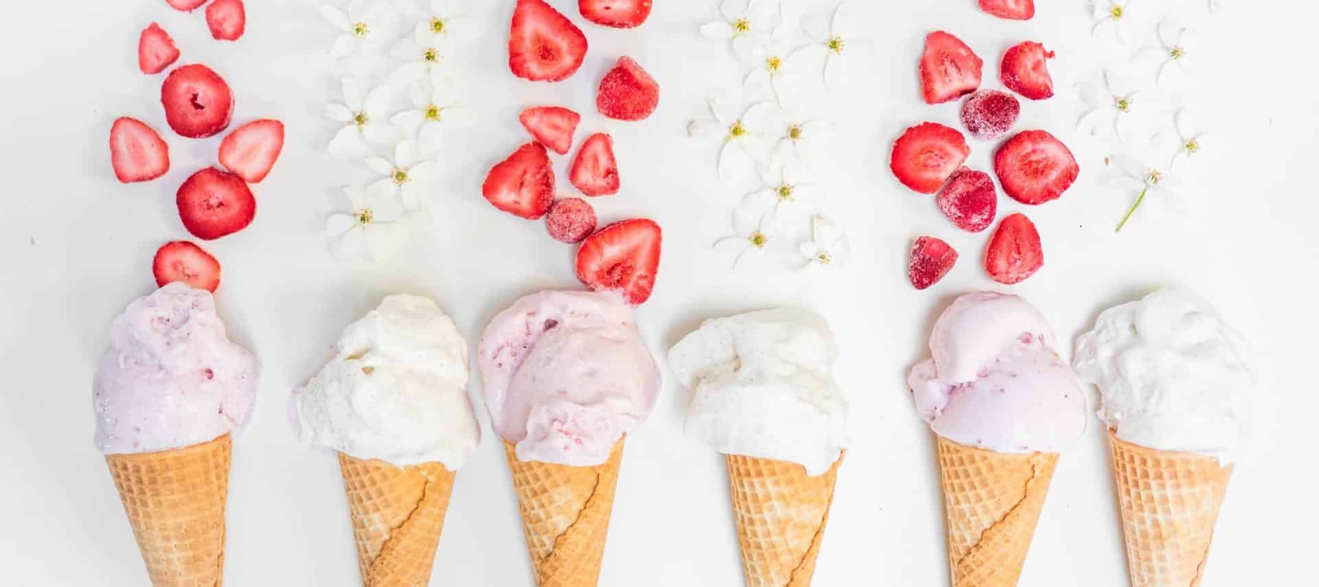 Ice cream cones with strawberries and flowers.
