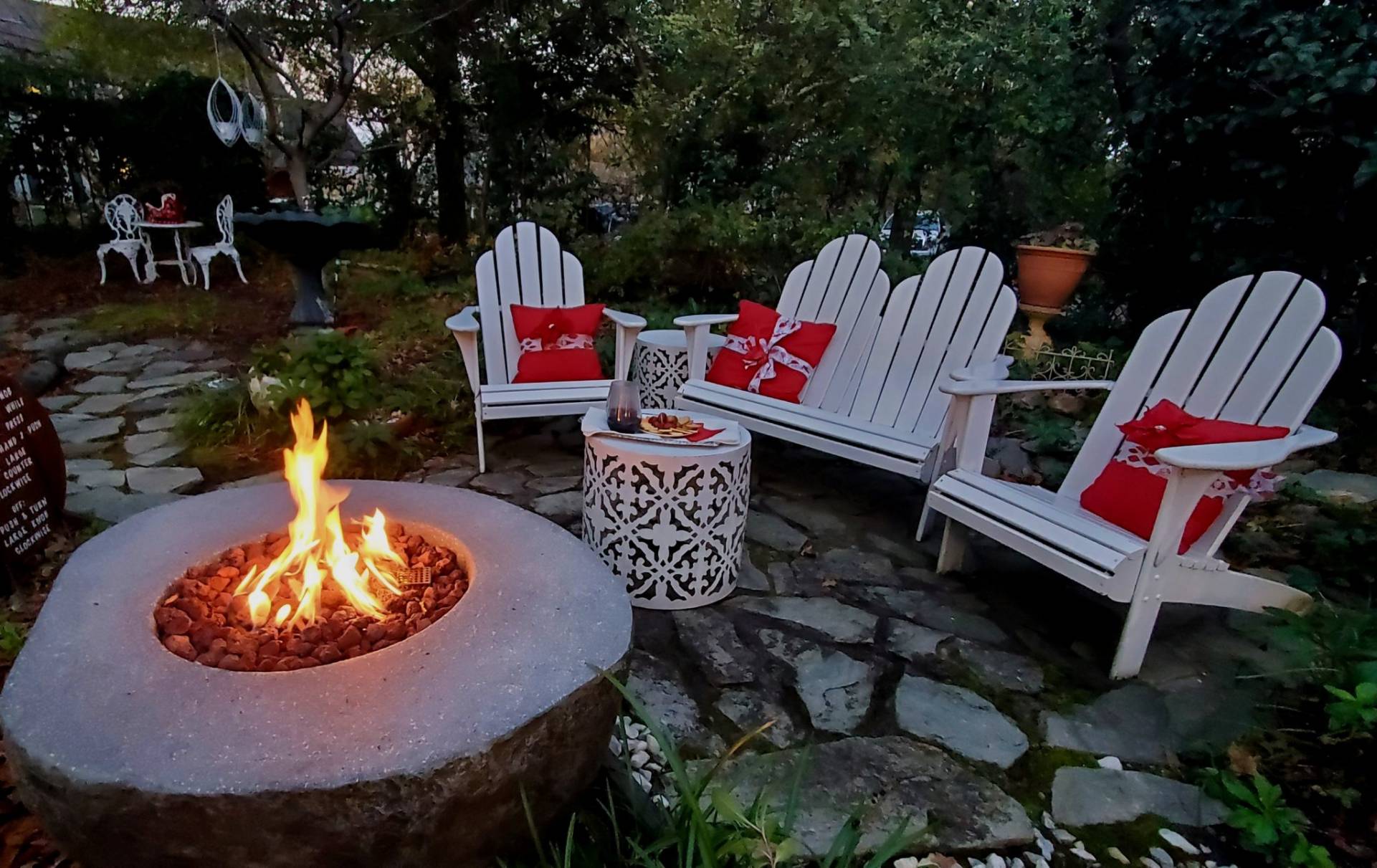 Crackling fire near seating area with wine and cheese tray.