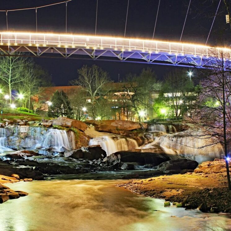 The liberty bridge lit up at night